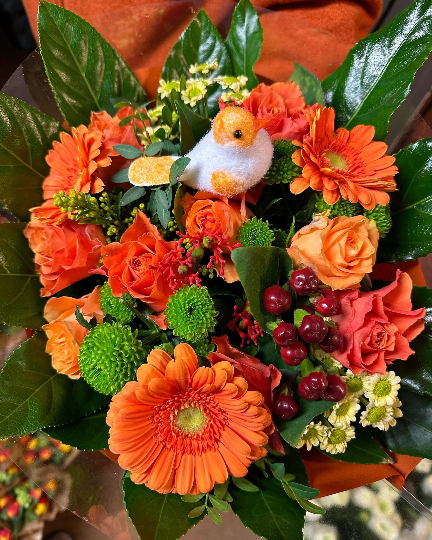 Bukett i varma orange toner
